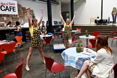 British performance artists Holly Darton (left) and Jenny Hunt, with pineapple tops strapped on their heads, entertain audiences with their comical act at the Ullens Center for Contemporary Art in Beijing.(Photo by Feng Yongbin/China Daily)