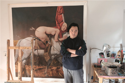 The artist poses before one of his works, Horseback Rider No 1, in his studio in New York City. (Photo provided to China Daily)