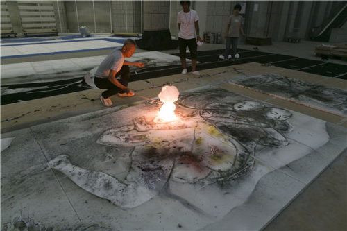 Cai makes an explosion while creating his gunpowder painting Seasons of Life.