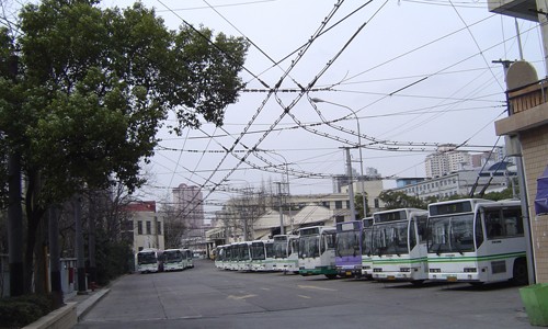 Trolley buses line up at a bus depot in Putuo district. 