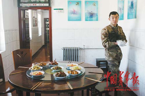 A soldier prepares lunch.
