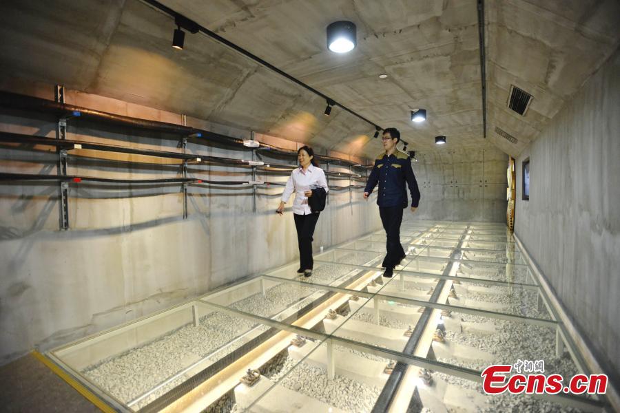 Visitors walk in a mock subway tunnel at the metro museum in Shanghai on Tuesday, October 28, 2014.[Photo: China News Service/ Yuan Jing]