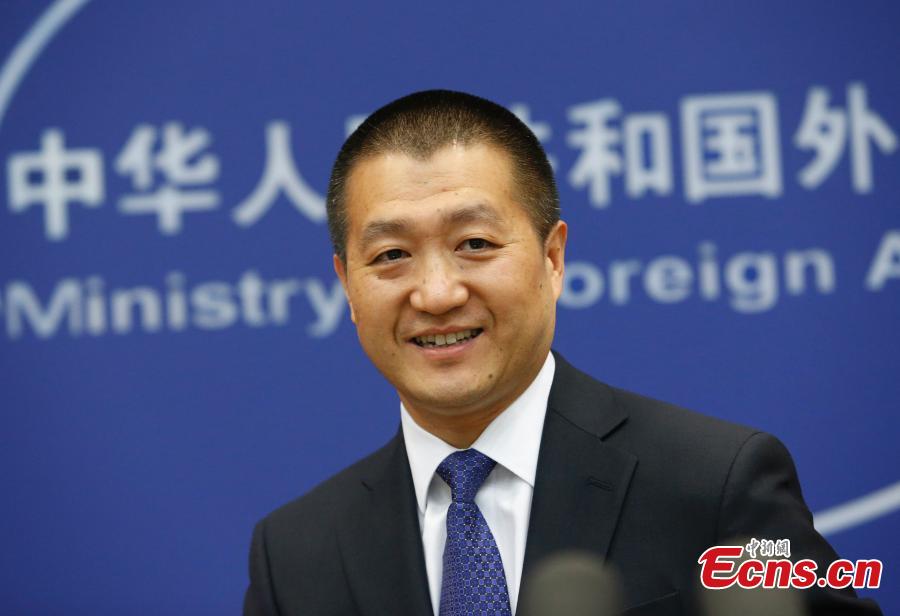 Lu Kang, the new spokesman of Foreign Ministry, gestures during a press conference in Beijing, June 15, 2015. Lu admitted modestly to being a little nervous on his debut as a Foreign Ministry spokesman on Monday, despite a diplomatic career spanning 22 years. (Photo: China News Service/Liu Guanguan)