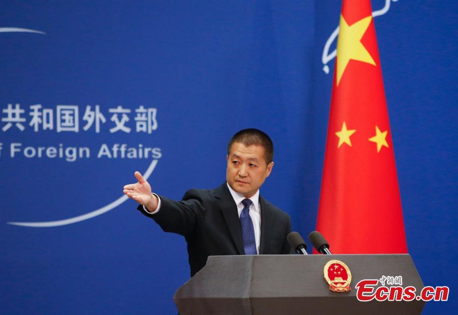 Lu Kang, the new spokesman of Foreign Ministry, gestures during a press conference in Beijing, June 15, 2015. Lu admitted modestly to being a little nervous on his debut as a Foreign Ministry spokesman on Monday, despite a diplomatic career spanning 22 years. (Photo: China News Service/Liu Guanguan)