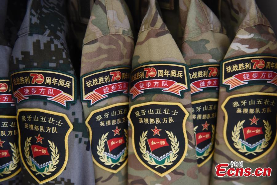 Aug. 22, Beijing, some PLA uniforms with the special parade arm badge, Chinese and foreign medias visit China\'s military parade camp on the day. The parade will be hold on September 3rd. (CNS photo/Liao Pan)