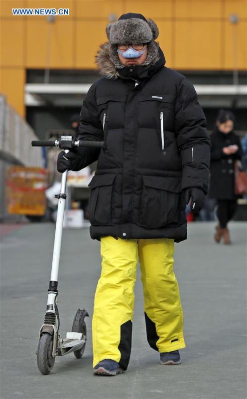 Temperatures in Beijing to hit 30-year low(1/4)