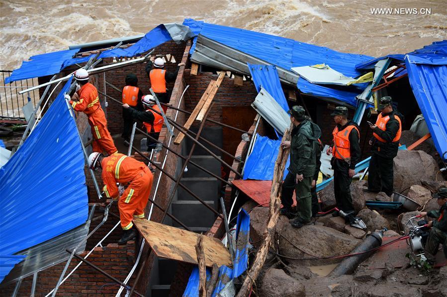 Rescuers search for signs of life at landslide site in SE China (1/8)