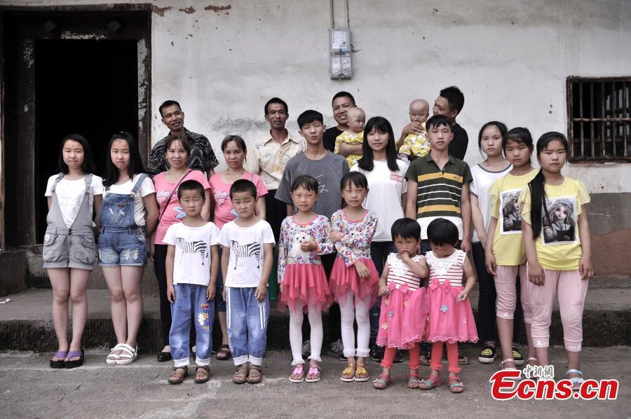 
Twins pose for a group photo in Qingyan Village, Jiangjin District, Southwest China’s Chongqing Municipality, July 5, 2016. The village of 367 households has 39 pairs of twins, with the oldest 89 years old. (Photo: China News Service/Chen Chao)