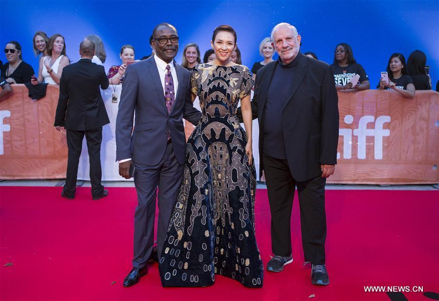 Chinese actress and member of the jury Zhang Ziyi (C) poses for photos with directors Brian De Palma (R) and Mahamat-Saleh Haroun before the world premiere of the opening film \