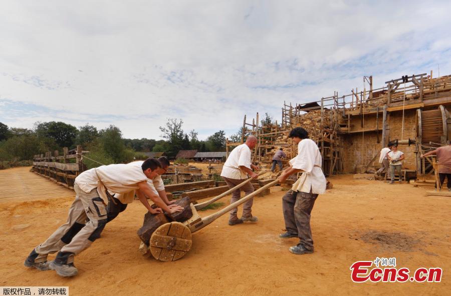 The Guédelon Castle under construction in Treigny, France, Sept. 13, 2016. Conceived by Michel Guyot, owner of Saint-Fargeau Castle, the project started in 1997 and the aim is to build an entire castle using nothing but tools, techniques, and materials that 13th century workers would use. The project has created jobs and is now a tourist destination, with more than 300,000 visits each year. (Photo/Agencies)
