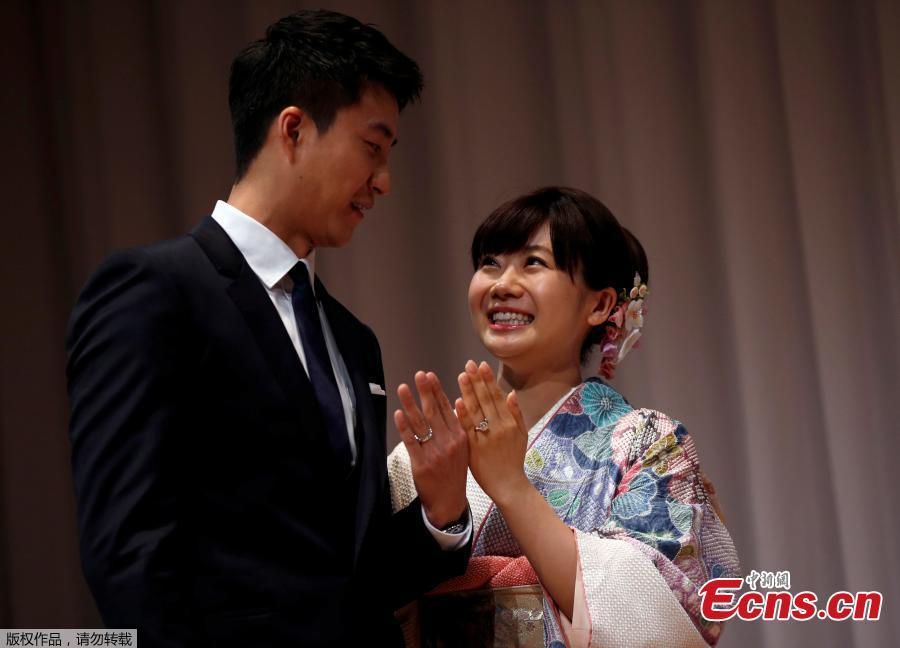 Japanese table tennis player Ai Fukuhara and Taiwanese table tennis player Hung-Chieh Chiang attend a press conference about their marriage in Tokyo, Japan, Sept. 21, 2016. The couple is planning to hold wedding ceremonies in Taipei and Tokyo before the end of the year, according to Japanese media reports. (Photo/Agencies)