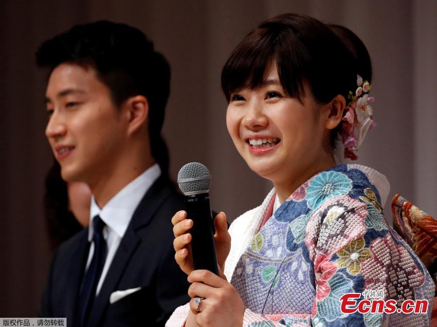 Japanese table tennis player Ai Fukuhara and Taiwanese table tennis player Hung-Chieh Chiang attend a press conference about their marriage in Tokyo, Japan, Sept. 21, 2016. The couple is planning to hold wedding ceremonies in Taipei and Tokyo before the end of the year, according to Japanese media reports. (Photo/Agencies)