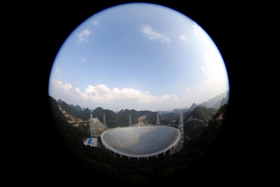 This scene taken from FAST\'s viewing platform shows the panorama of the 500-meter Aperture Spherical Telescope in Pingtang county, Guizhou province, Sept 24, 2016. (Photo/Xinhua)