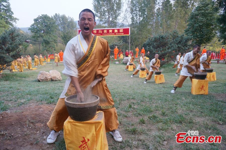 Kung fu students perform during the opening ceremony of the 11th Zhengzhou International Shaolin Kung Fu Festival in Dengfeng, Central China’s Henan Province, Oct. 16, 2016. Students from the famed Tagou Kung Fu School showed off all kinds of kung fu stunts. (Photo: China News Service/Han Zhangyun)