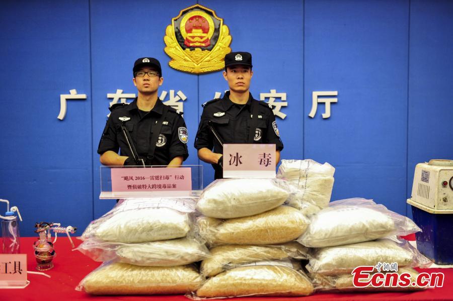 Drugs and drug-making equipment are on display after police busted a cross-border smuggling ring in South China’s Guangdong Province. Local police detained more than 10 suspects, shut down two drug-making sites and confiscated two tons of methamphetamine. In the first nine months, Guangdong police caught 19,000 suspects in drug cases and also disciplined 119,000 drug addicts. (Photo: China News Service/Chen Jimin)