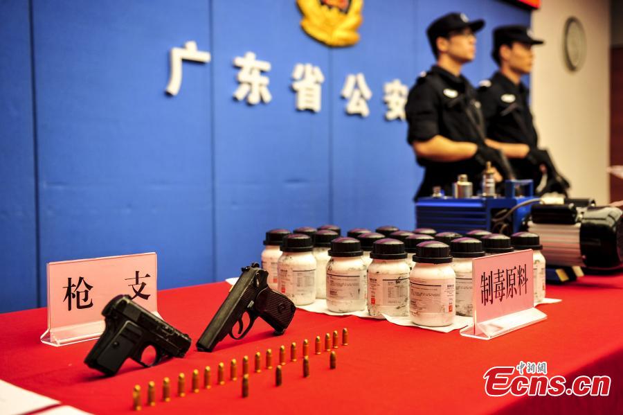 Drugs and drug-making equipment are on display after police busted a cross-border smuggling ring in South China’s Guangdong Province. Local police detained more than 10 suspects, shut down two drug-making sites and confiscated two tons of methamphetamine. In the first nine months, Guangdong police caught 19,000 suspects in drug cases and also disciplined 119,000 drug addicts. (Photo: China News Service/Chen Jimin)