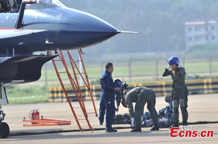 Female fighter jet pilots are ready to perform at Airshow China 2016 on November 1, 2016. The biennial event is held in the coastal city of Zhuhai, South China\'s Guangdong province, from Nov 1 to 6, attracting more than 700 exhibitor from 42 countries and regions.(Photo: China News Service/Jin Shuo)