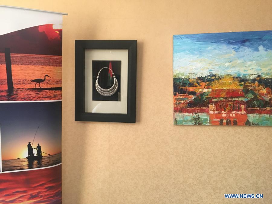 Traditional cuisines in Maldives are introduced by Ambassador of the Maldives to China Mohamed Faisal and his wife during the activity \