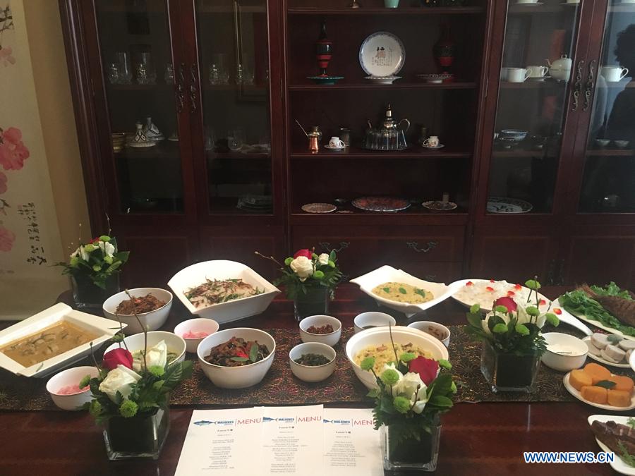 Traditional cuisines in Maldives are introduced by Ambassador of the Maldives to China Mohamed Faisal and his wife during the activity \