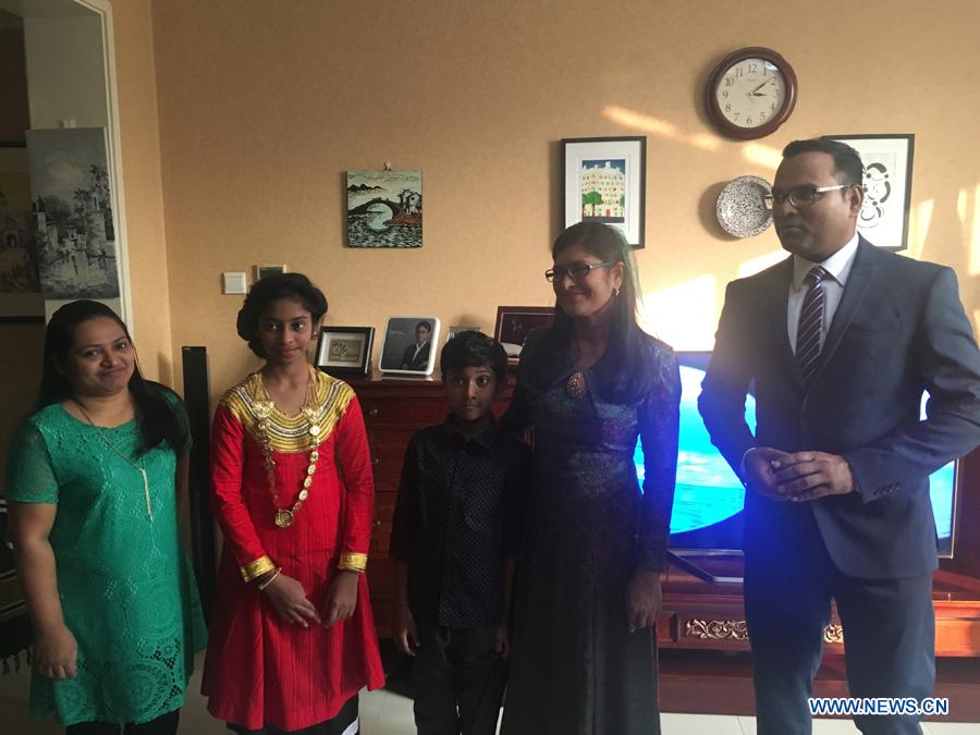 Traditional cuisines in Maldives are introduced by Ambassador of the Maldives to China Mohamed Faisal and his wife during the activity \