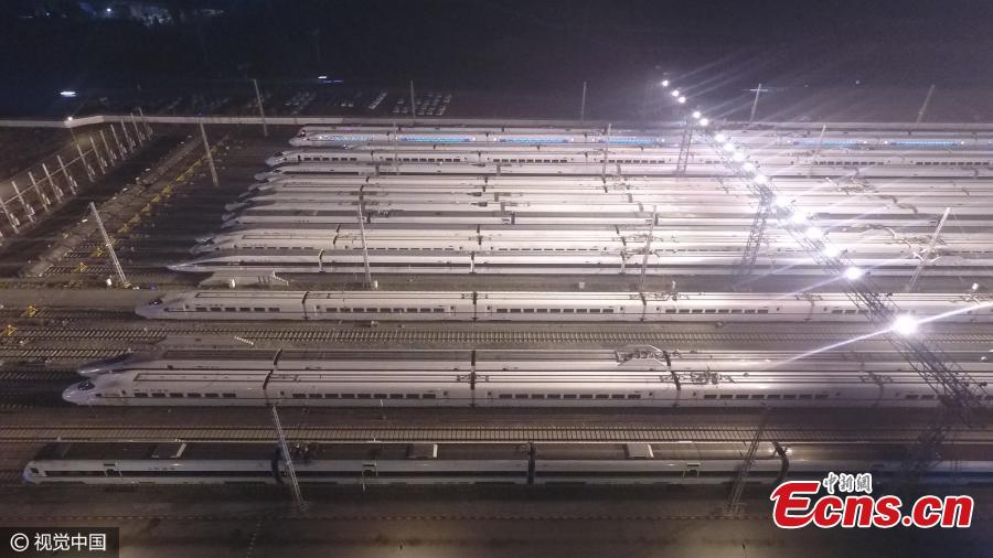 Lines of high-speed trains are parked on tracks awaiting checks in Southwest China’s Chongqing Municipality, Feb. 6, 2017. All fast trains were required to undergo maintenance after 2am during the Spring Festival travel rush. (Photo/CFP)