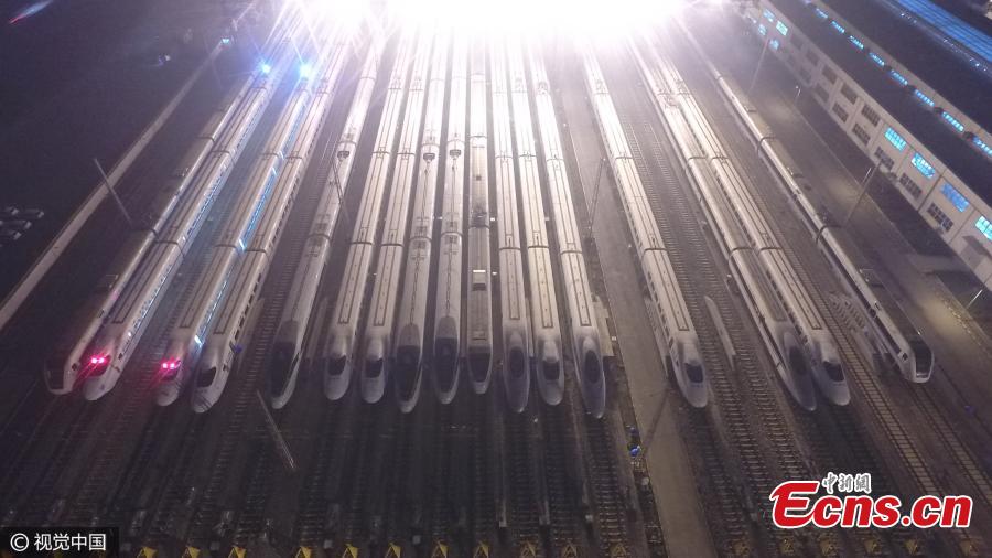 Lines of high-speed trains are parked on tracks awaiting checks in Southwest China’s Chongqing Municipality, Feb. 6, 2017. All fast trains were required to undergo maintenance after 2am during the Spring Festival travel rush. (Photo/CFP)