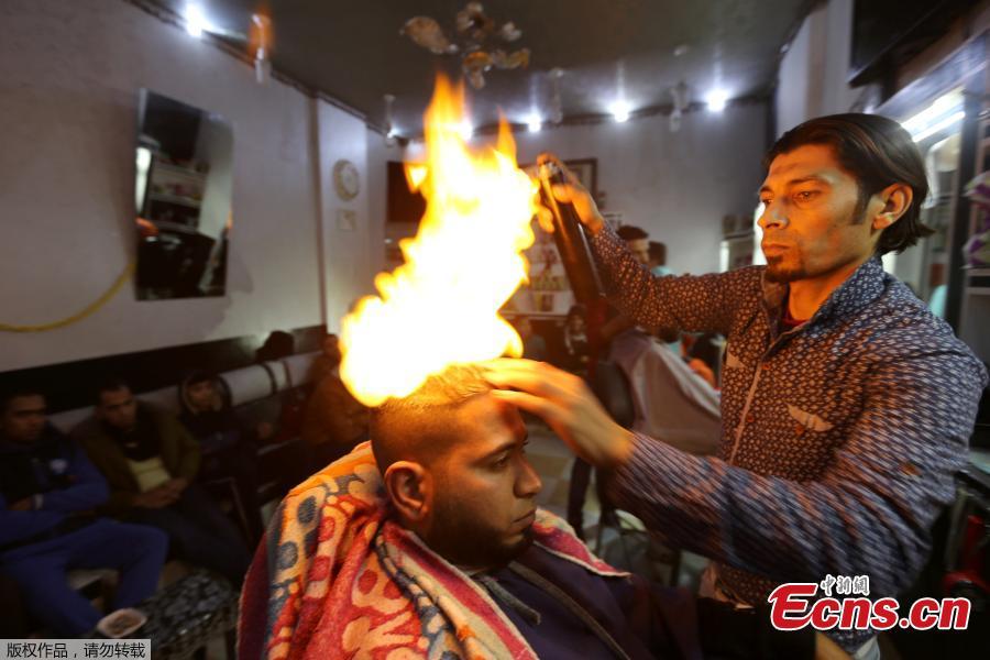 Gazan barber offers flaming hot hair
