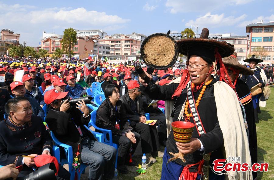 Bimo, shaman-priests of the Yi people’s religion Bimoism, prays during the opening ceremony of a tiger-themed cultural festival in Shuangbai County, Southwest China’s Yunnan Province, March 7, 2017. The tiger is the totem animal of the Yi people in the county. (Photo: China News Service/Li Jinhong)