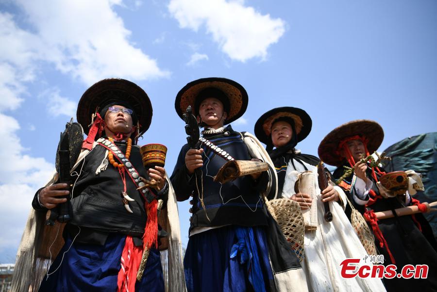 Women of the Yi ethnic group attend the opening ceremony of a tiger-themed cultural festival in Shuangbai County, Southwest China’s Yunnan Province, March 7, 2017. The tiger is the totem animal of the Yi people in the county. (Photo: China News Service/Li Jinhong)