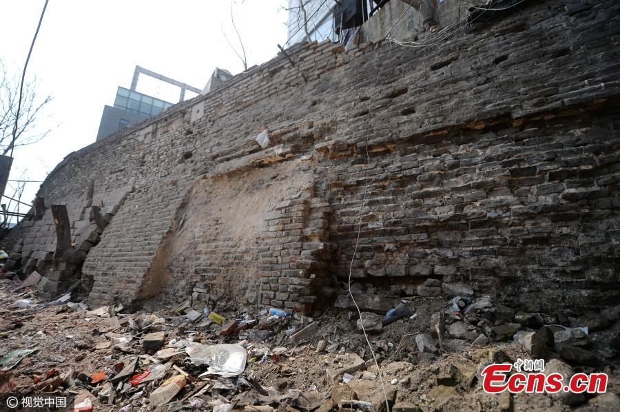 The remains of the old city wall in Jinan, capital of East China’s Shandong Province reappear after unauthorized buildings in front of it are destroyed, March 15, 2017. Jinan had massive, imposing city walls about 10.66 meters high and 16.67 meters wide during the Ming Dynasty (1368-1644), but they were mostly destroyed in 1950 to allow space to build a ring road, according to Li Ming, the director of the Archaeological Institute of Jinan City. The city plans to make the newly found 14-meter-long stretch of city wall the centerpiece of a cultural attraction. (Photo/CFP)