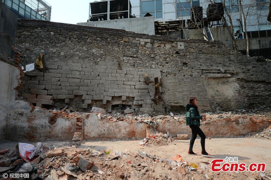 The remains of the old city wall in Jinan, capital of East China’s Shandong Province reappear after unauthorized buildings in front of it are destroyed, March 15, 2017. Jinan had massive, imposing city walls about 10.66 meters high and 16.67 meters wide during the Ming Dynasty (1368-1644), but they were mostly destroyed in 1950 to allow space to build a ring road, according to Li Ming, the director of the Archaeological Institute of Jinan City. The city plans to make the newly found 14-meter-long stretch of city wall the centerpiece of a cultural attraction. (Photo/CFP)