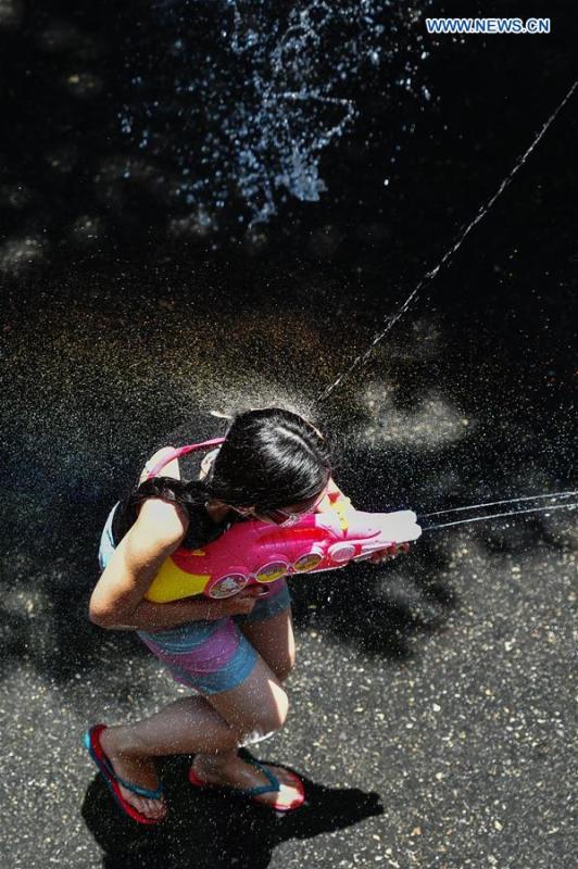 People participate in a water fight during the Songkran Festival celebration in Bangkok, Thailand, April 13, 2017. Songkran Festival, also known as water festival, is celebrated in Thailand as the traditional New Year\'s Day, which normally falls on April 13 to 15. (Xinhua/Rachen Sageamsak)