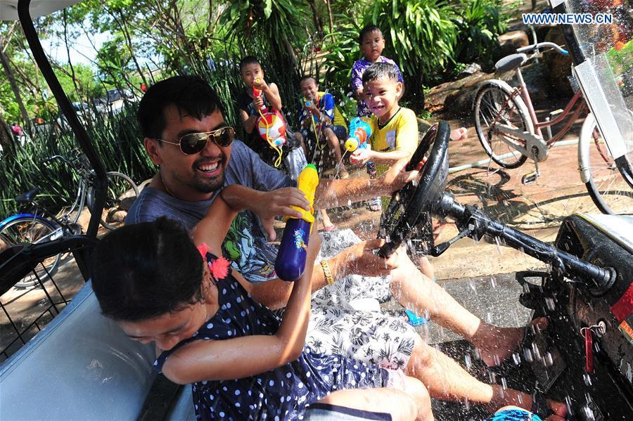People participate in a water fight during the Songkran Festival celebration in Bangkok, Thailand, April 13, 2017. Songkran Festival, also known as water festival, is celebrated in Thailand as the traditional New Year\'s Day, which normally falls on April 13 to 15. (Xinhua/Rachen Sageamsak)