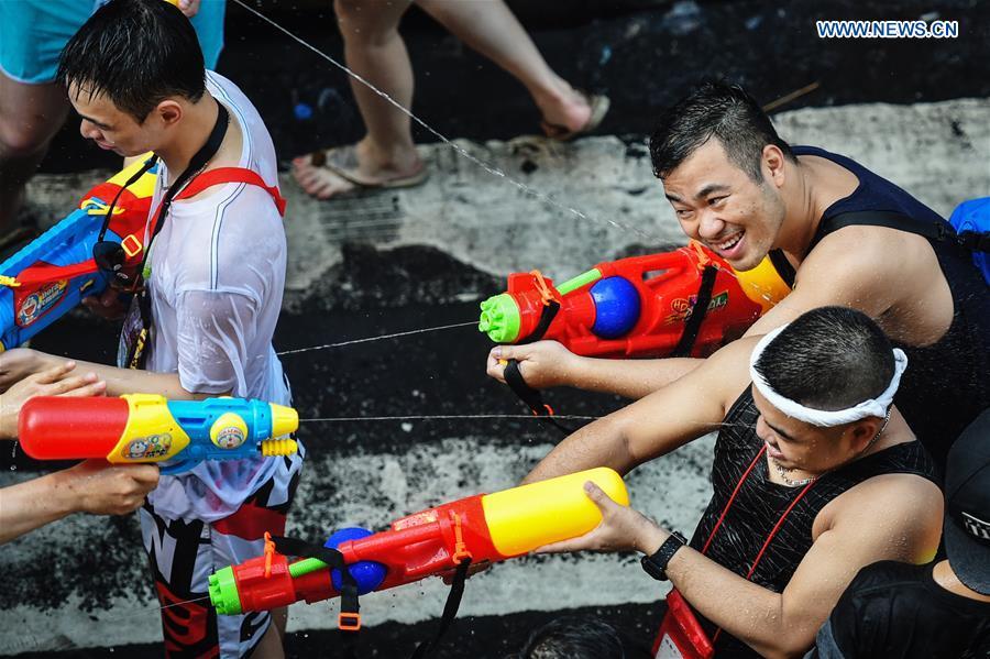 People participate in a water fight during the Songkran Festival celebration in Bangkok, Thailand, April 13, 2017. Songkran Festival, also known as water festival, is celebrated in Thailand as the traditional New Year\'s Day, which normally falls on April 13 to 15. (Xinhua/Rachen Sageamsak)