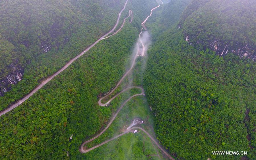 Aerial photo taken on May 22, 2017 shows roads in Qibainong Township in Dahua Yao Autonomous County, south China\'s Guangxi Zhuang Autonomous Region. Guangxi strengthened road construction efforts in poor rural areas in recent years. (Xinhua/Huang Xiaobang)