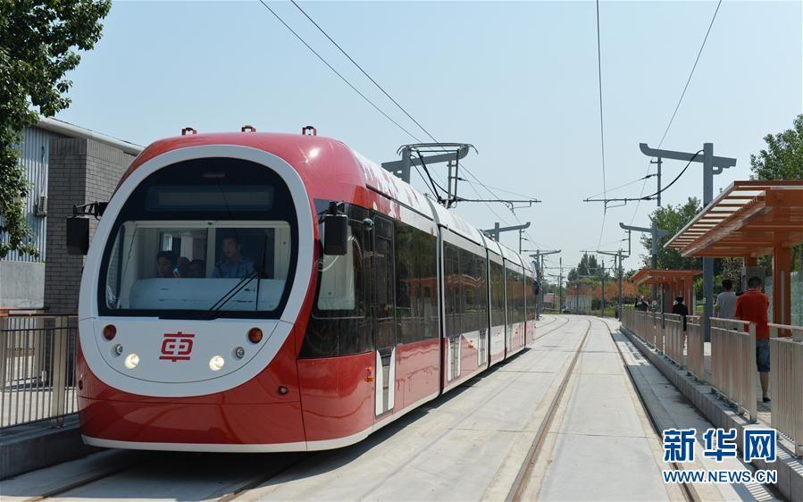 A new model of tram, applauded as the most beautiful tram, is being tested on the western suburbs line in Beijing, June 26, 2017. The tramcar, which is 32 meters long and can carry 300 people per carriage, is expected to carry as many as 10, 000 people in a one-way trip at peak time per hour. (Photo/Xinhua)