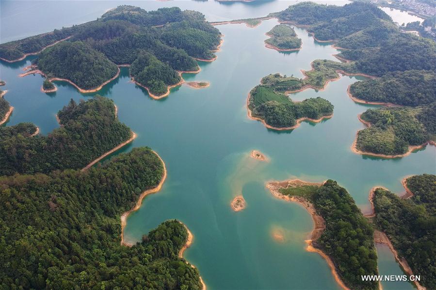 Aerial photo taken on Aug. 8, 2017 shows the scenery of Qiandao Lake, or Thousand-Island Lake, in Chun\'an County, east China\'s Zhejiang Province. The lake covers 573 square kilometers, and is home to 114 known fish species, with an economic value of over 4 billion yuan (600 million U.S. dollars). (Xinhua/Zhang Cheng)