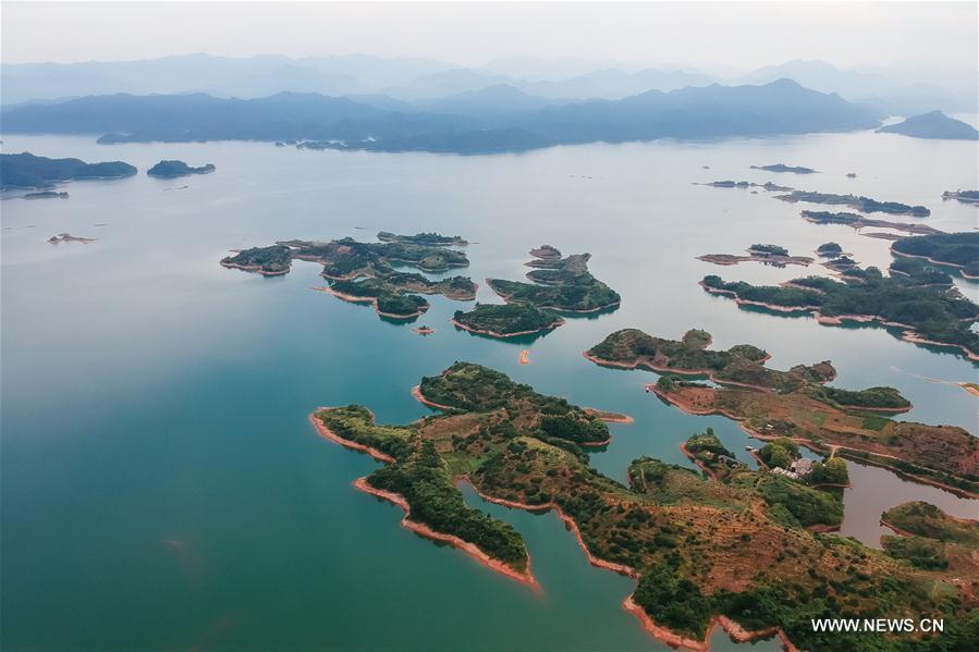 Aerial photo taken on Aug. 7, 2017 shows the scenery of Qiandao Lake, or Thousand-Island Lake, in Chun\'an County, east China\'s Zhejiang Province. The lake covers 573 square kilometers, and is home to 114 known fish species, with an economic value of over 4 billion yuan (600 million U.S. dollars). (Xinhua/Zhang Cheng)