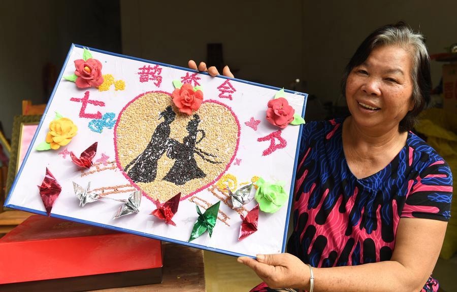 An elderly woman shows a handmade artwork made of grains in Nanning, Guangxi Zhuang autonomous region, Aug. 27, 2017. (Photo/Xinhua)

Customs

In bygone days, Qixi was not only a special day for lovers, but also for girls. It is also known as the \