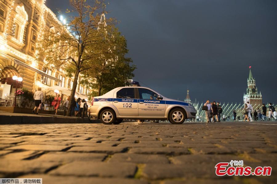 A police car stops near Red Square in Moscow, Russia, Sept. 13, 2017. More than 20,000 people have been evacuated from public spaces across Moscow after authorities received several bomb threats. (Photo/Agencies)