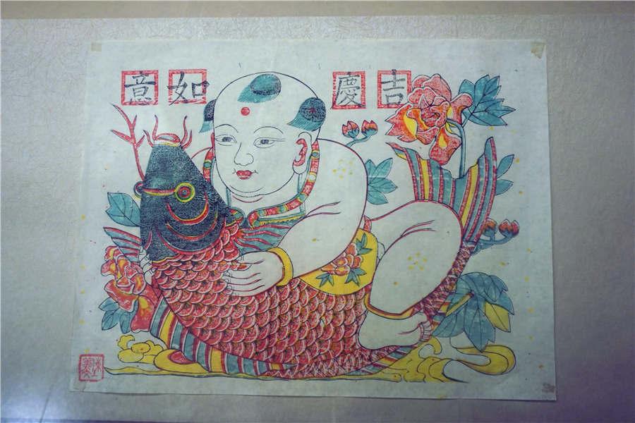 A wood engraving New Year painting by Chen Yiwen. (Photo/chinadaily.com.cn)