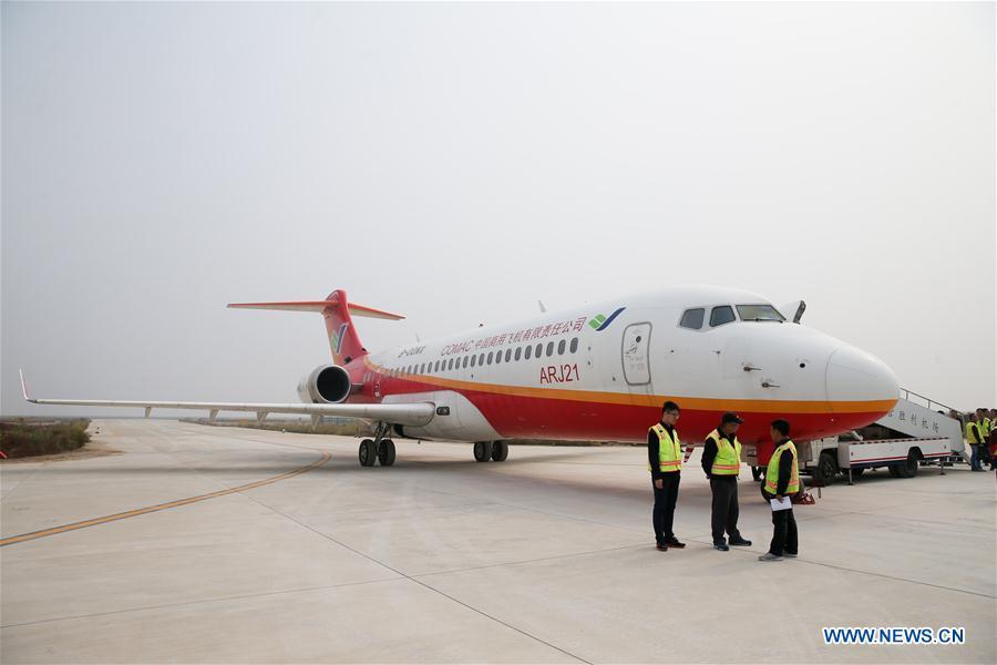 Photo taken on Oct. 14, 2017 shows an ARJ21-700 plane that performs a test flight at an airport in Dongying, east China\'s Shandong Province. The Chinese-developed regional jetliner, which has the BeiDou navigation system installed, has successfully completed a test flight, the Commercial Aircraft Corporation of China (COMAC) said Saturday. (Xinhua/Ding Ting)