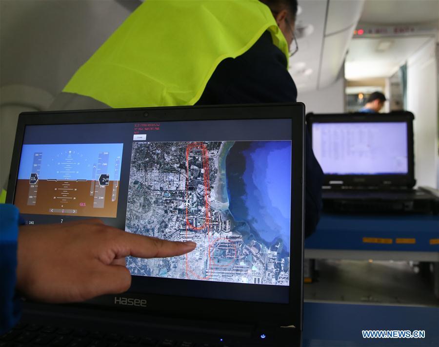 A staff member shows the flight path drew by the BeiDou navigation system on an ARJ21-700 plane during a test flight in Dongying, east China\'s Shandong Province, Oct. 14, 2017. The Chinese-developed regional jetliner, which has the BeiDou navigation system installed, has successfully completed a test flight, the Commercial Aircraft Corporation of China (COMAC) said Saturday. (Xinhua/Ding Ting)
