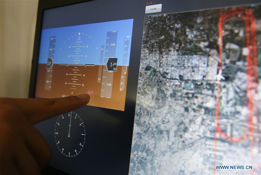 A staff member shows the monitor of the flight attitude of an ARJ21-700 plane during a test flight in Dongying, east China\'s Shandong Province, Oct. 14, 2017. The Chinese-developed regional jetliner, which has the BeiDou navigation system installed, has successfully completed a test flight, the Commercial Aircraft Corporation of China (COMAC) said Saturday. (Xinhua/Ding Ting)