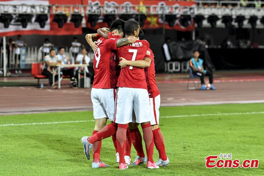 Members of Guangzhou Evergrande Taobao celebrate after scoring a goal during a Chinese Football Association Super League match in Guangzhou City, the capital of South China’s Guangdong Province, Oct. 22, 2017. Guangzhou Evergrande Taobao has secured its seventh consecutive Championship with two group games remaining following the victory. (Photo: China News Service/Chen Jimin)