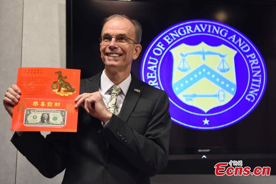 
<p>Leonard Olijar, Director of the Bureau of Engraving and Printing, introduces the Year of the Dog 2018 one dollar bill in honor of the Chinese Lunar New Year at the Bureau of Engraving and Printing in Washington, DC, on November 15, 2017. The Year of the Dog 2018 features a $1 Federal Reserve note with a serial number beginning with 
