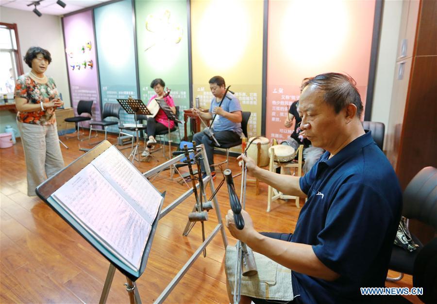 Elderly residents participate in a rehearsal at a daycare center of Yuxin Community in Taocheng District, Hengshui City, north China's Hebei Province, Aug. 3, 2017. Eight daycare centers for the elderly have been established to provide older people with food, entertainment, counselling and physical health care since 2016 in Taocheng District. (Xinhua/Mu Yu)