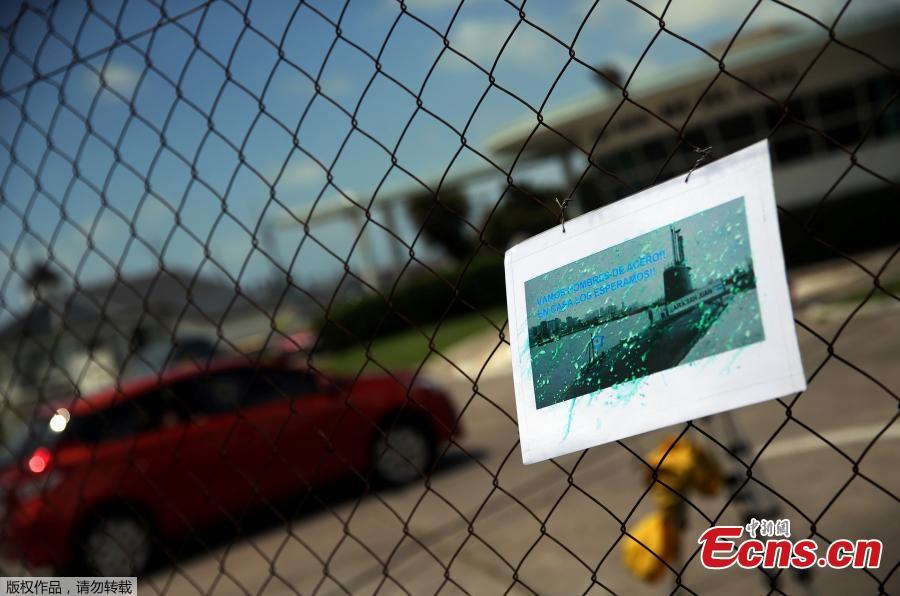 A car enters the Argentine Naval Base where the missing at sea ARA San Juan submarine sailed from as a picture of it hangs on a fence in Mar del Plata, Argentina November 19, 2017. Words in the picture read 