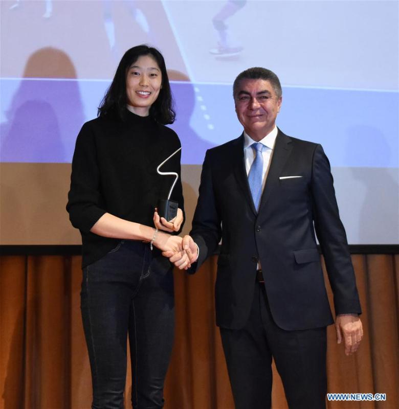 Zhu Ting (L) poses with Turkish Volleyball Federation official Kurtaran Mumcu during the awarding ceremony at Bosphorus University in Istanbul, Turkey, Dec. 18, 2017. Chinese volleyball star and Turkey\'s Vakifbank player Zhu Ting was awarded the Best Volleyball Player of 2017 Bosphorus University Sports Awards here on Monday. (Xinhua/He Canling)