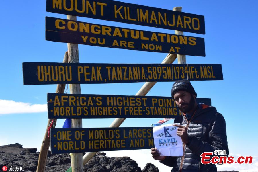 Madhusudan Patidar, a resident of Rau in Indore, India, reaches the peak of Mt Kilimanjaro in Tanzania, at an altitude of 5,895 meters on Dec. 18, 2017. The 21-year-old mountaineer started climbing the highest African peak on Dec. 15 and took three days to reach the top. He then stayed at the peak for 22 hours at a stretch despite the chilling wind and the lack of oxygen, setting a record. (Photo/IC)